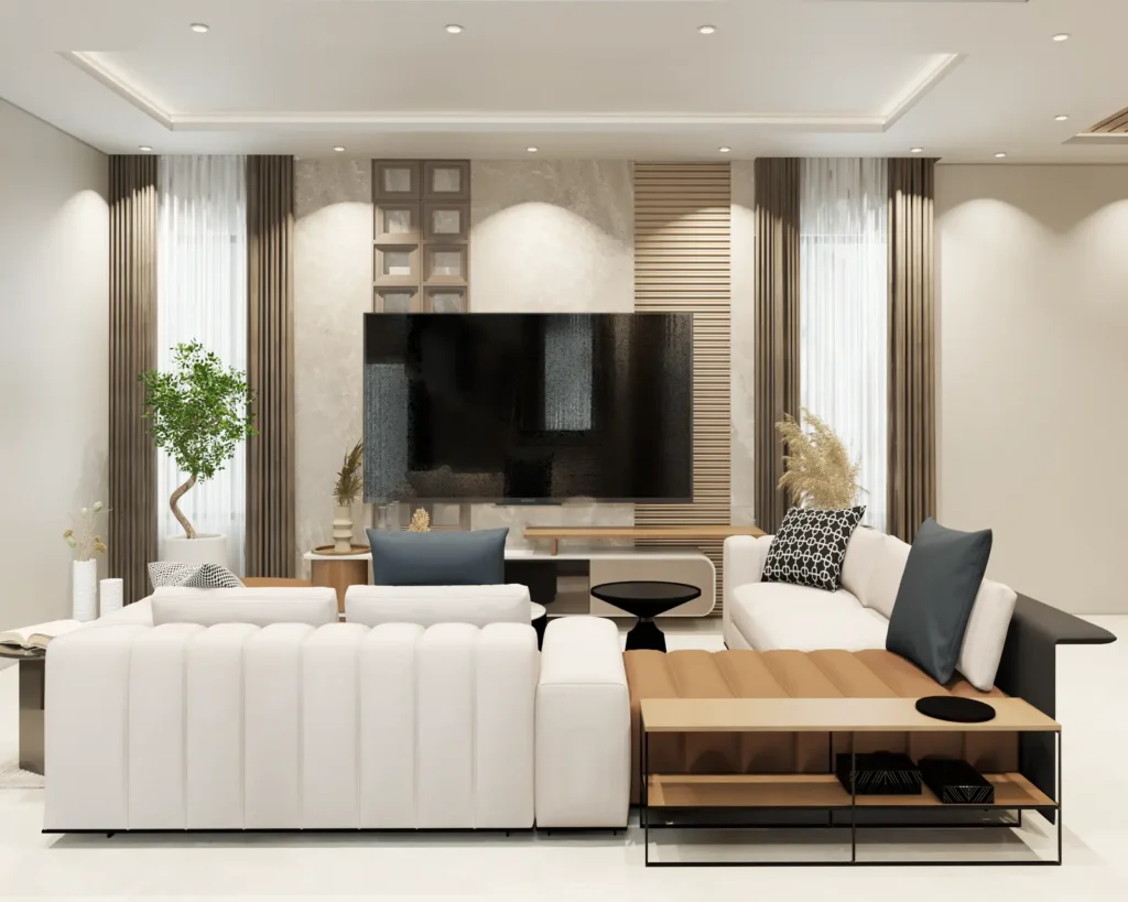 3D design of a 4 BHK living room in Vijayapura with marble TV wall, fluted wooden panel, channel-tufted sectional sofa and cove-lit ceiling by Aladi Interiors