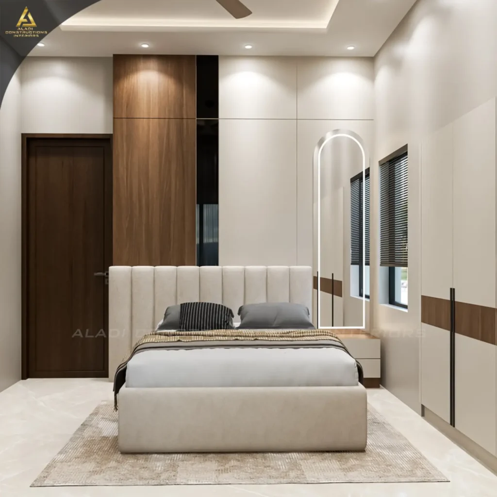 3D design of a Mudhol bedroom with channel-tufted upholstered bed, wood and ivory wardrobe, arched LED mirror and cove-lit ceiling by Aladi Interiors
