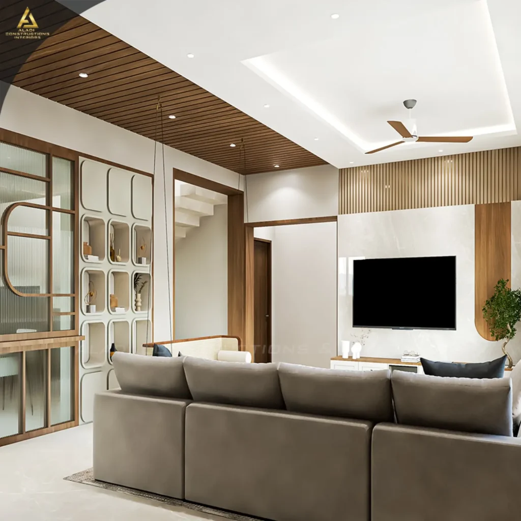 3D design of a Mudhol living room with marble-finish TV wall, fluted wooden panelling, wooden slat ceiling, display niches and indoor swing by Aladi Interiors