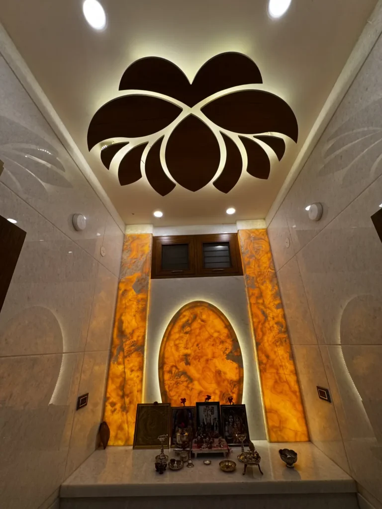 Pooja room with backlit onyx panels, arched mandir backdrop and lotus false ceiling in a 3 BHK home in Gulbarga by Aladi Interiors